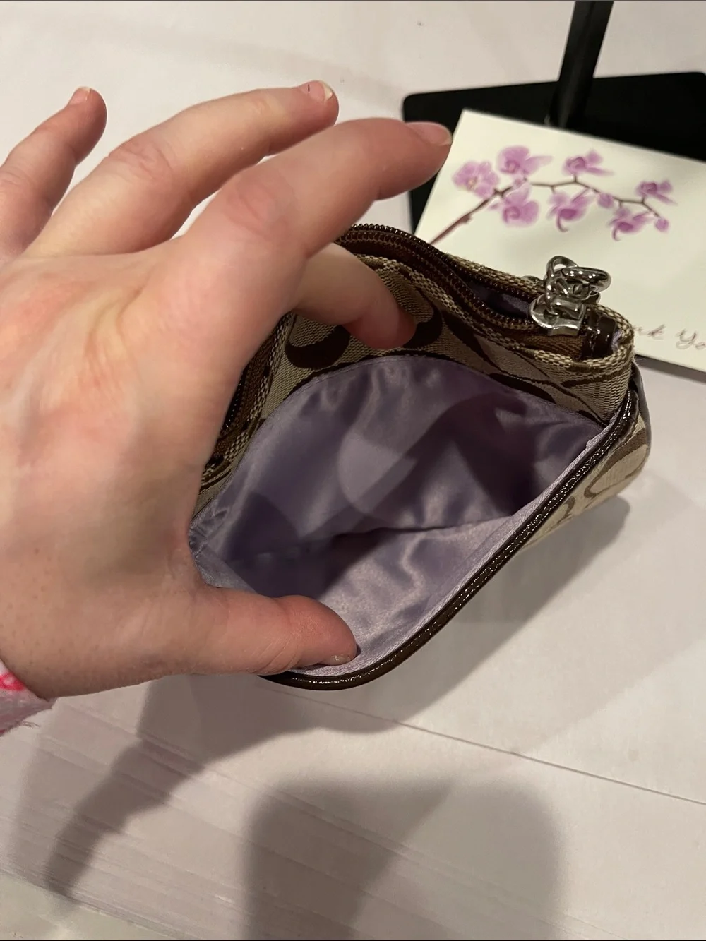 Coach Signature Small Wristlet in a khaki zipped coin purse
